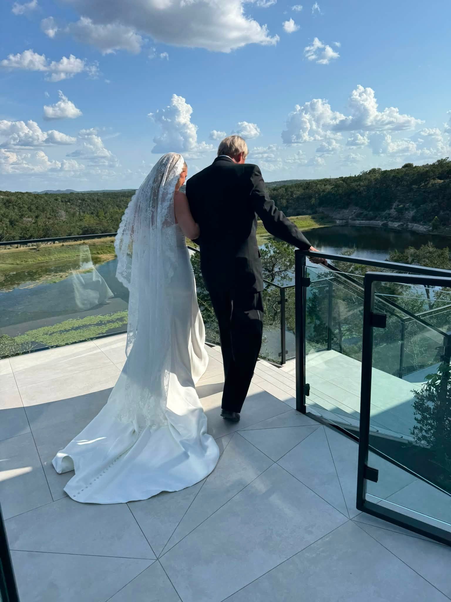 Bride sharing a quiet balcony moment before the celebration