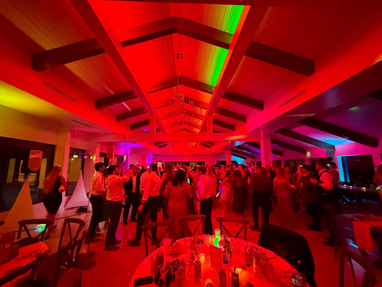 Wedding guests celebrating on the dance floor
